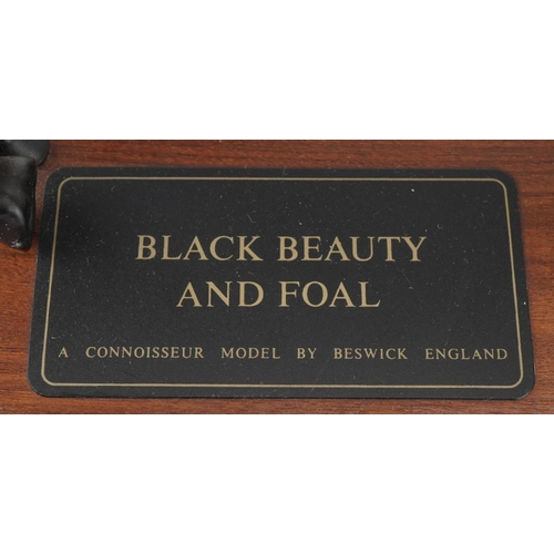 446 - Beswick Connoisseur model of Black Beauty and foal raised on a wooden plinth base, 29.5cm in length