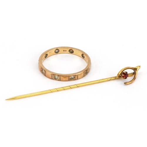 2314 - 9ct gold clear stone eternity ring and an unmarked gold wishbone stickpin set with a red stone, test... 