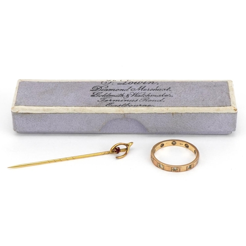 2314 - 9ct gold clear stone eternity ring and an unmarked gold wishbone stickpin set with a red stone, test... 