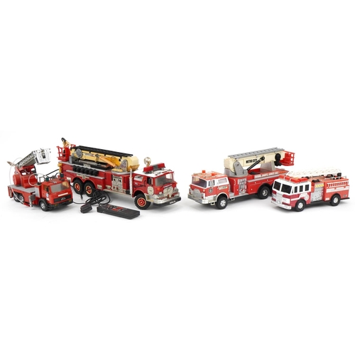 1468 - Four large vintage and later battery operated fire trucks, the largest 68cm in length