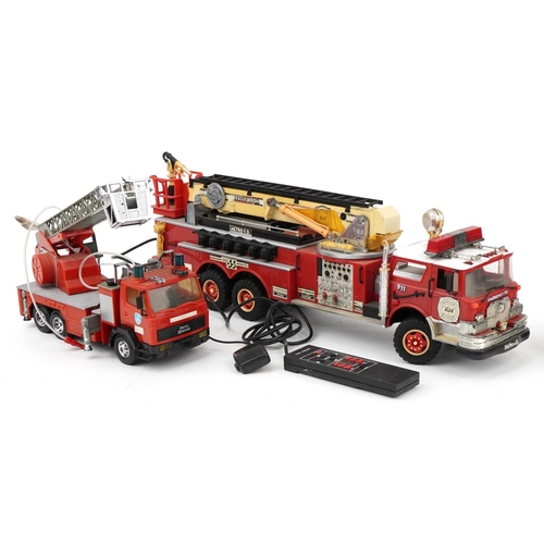 1468 - Four large vintage and later battery operated fire trucks, the largest 68cm in length