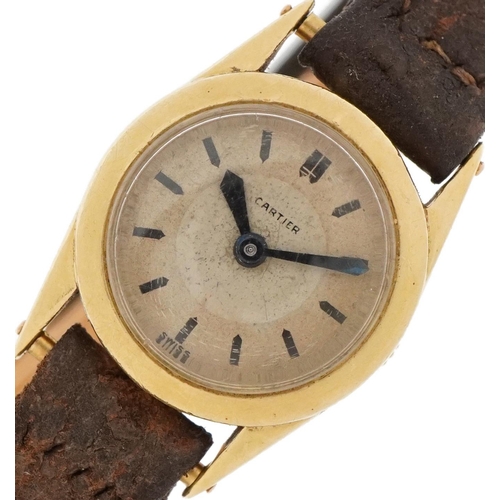 2013 - Cartier, early 20th century ladies gold Cartier wristwatch with leather strap and 18ct gold strap mo... 