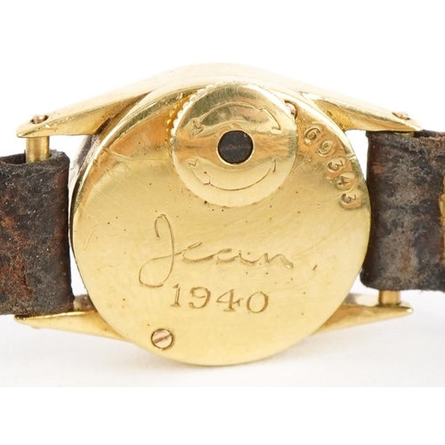 2013 - Cartier, early 20th century ladies gold Cartier wristwatch with leather strap and 18ct gold strap mo... 