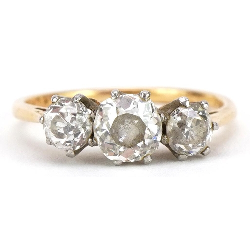 2003 - 18ct gold and platinum diamond three stone ring, the largest diamond approximately 0.42 carat, each ... 