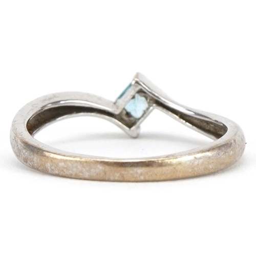 2319 - 9ct white gold blue topaz crossover ring, size M, 1.6g