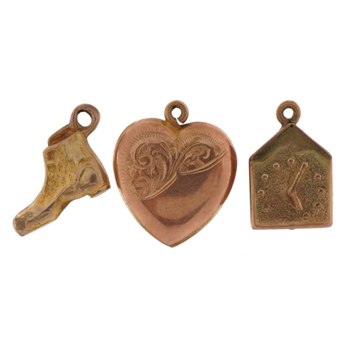 2209 - Three 9ct gold charms comprising love heart, boot and clock, the largest 1.6cm high, total 3.0g