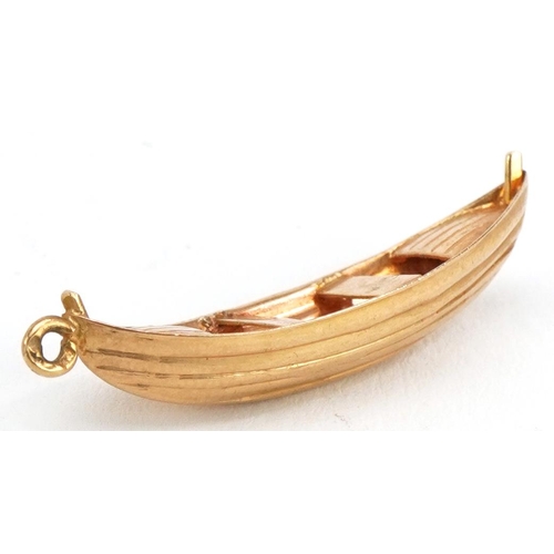 2211 - Gold rowing boat charm, indistinct marks, 2.7cm wide, 1.4g