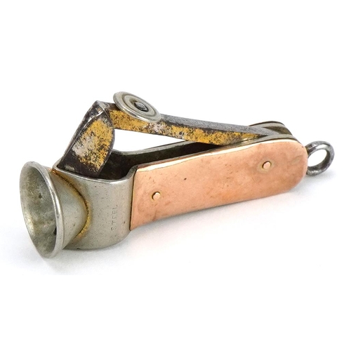 108 - Early 20th century 9ct gold mounted cigar cutter, 5cm in length