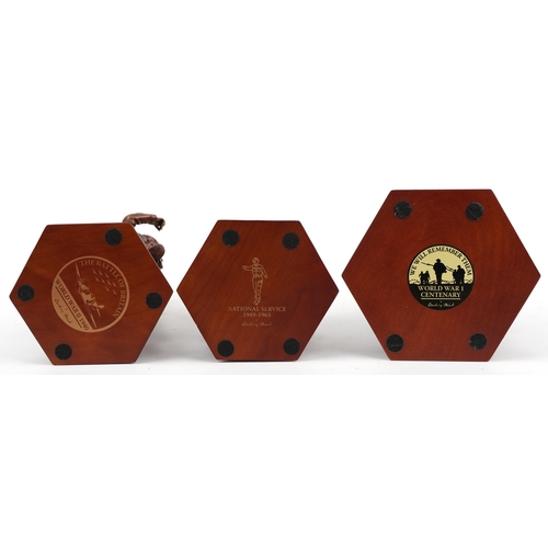 1567 - Three bronzed commemorative military figures raised on hexagonal wooden bases set with coins and med... 