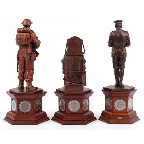 1566 - Three bronzed commemorative military figures raised on hexagonal wooden bases set with coins and med... 