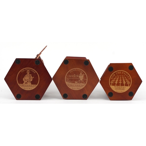 1566 - Three bronzed commemorative military figures raised on hexagonal wooden bases set with coins and med... 