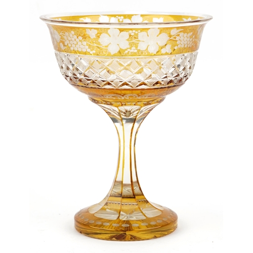 224 - Bohemian amber flashed cut glass centre piece etched with leaves and berries, 26cm high