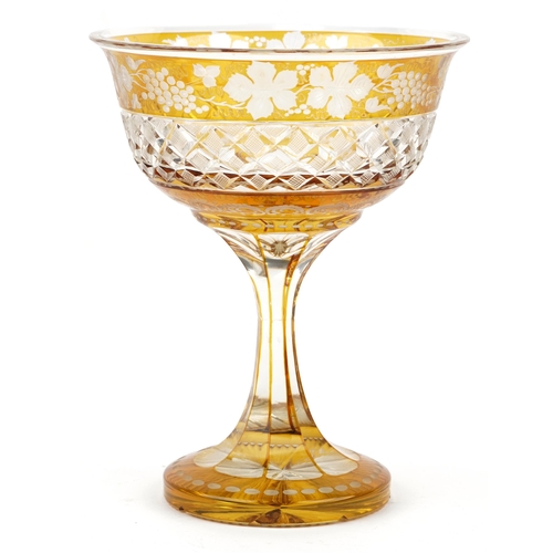 224 - Bohemian amber flashed cut glass centre piece etched with leaves and berries, 26cm high