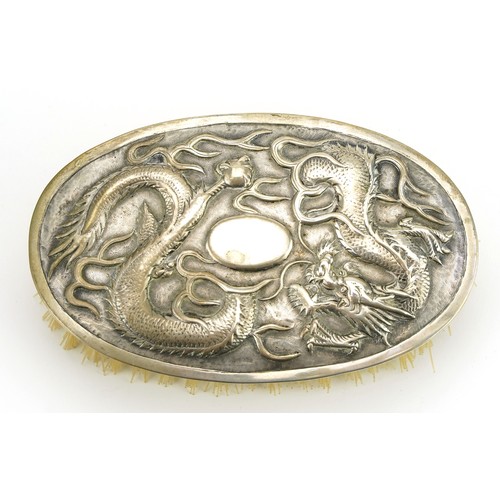19 - Hung Chong & Co, Chinese export silver mounted brush embossed with a dragon, 13cm wide, total weight... 