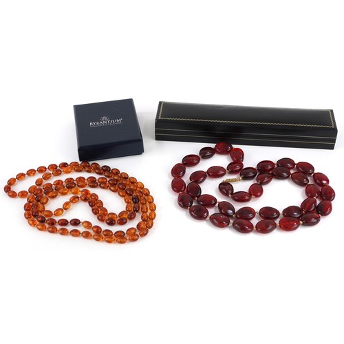 2339 - Two amber coloured bead necklaces including one with barrel clasp, the largest bead approximately 2.... 