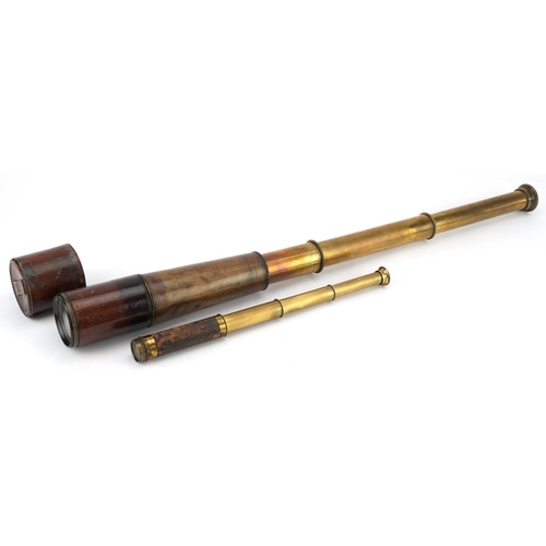 1545 - Two Victorian leather bound three draw brass telescopes, the largest 28cm in length when closed