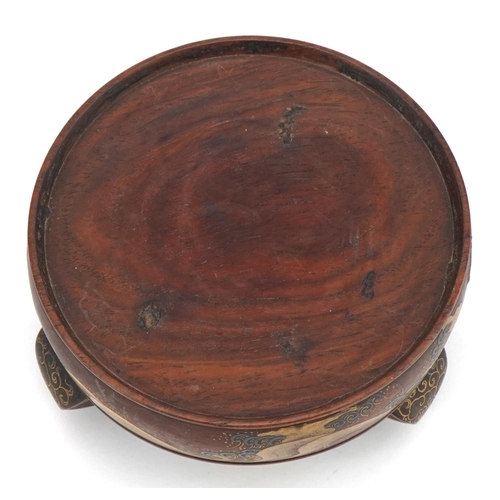 127 - Japanese hardwood three footed stand lacquered and gilded with crashing waves, 10.5cm in diameter