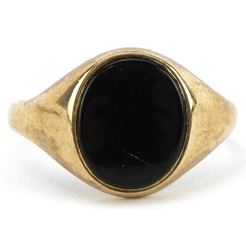 2120 - 9ct gold black onyx signet ring, the black onyx approximately 11.5mm x 9.7mm, size R, 2.5g