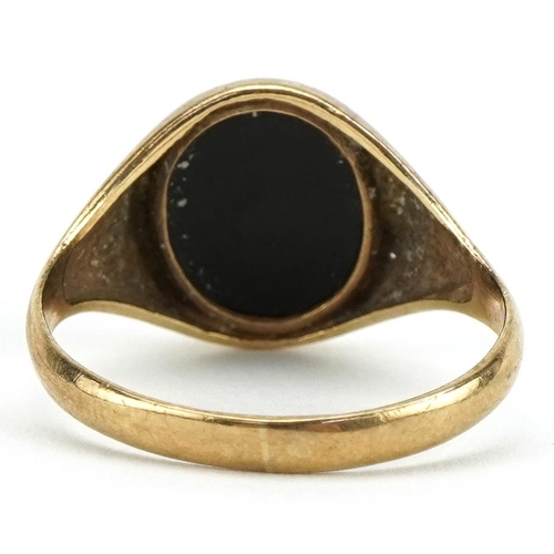 2120 - 9ct gold black onyx signet ring, the black onyx approximately 11.5mm x 9.7mm, size R, 2.5g