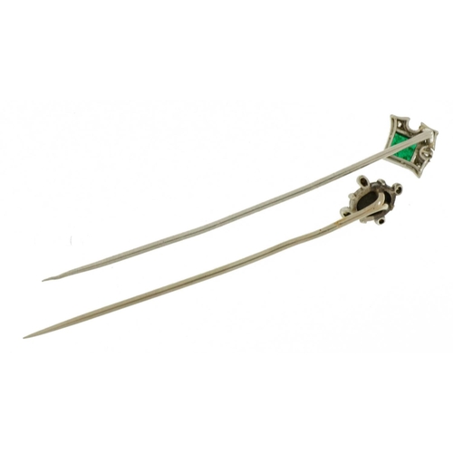 2113 - Two antique and later white metal stickpins housed in a leather box, comprising cabochon opal, white... 