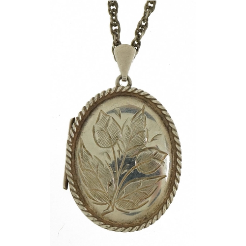 2380 - Oval silver locket with rope twist decoration and floral engraving on a silver necklace, 4.5cm high ... 