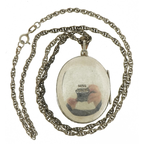 2380 - Oval silver locket with rope twist decoration and floral engraving on a silver necklace, 4.5cm high ... 