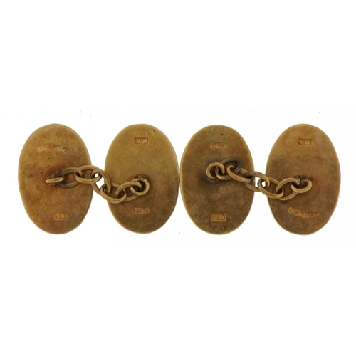 2123 - Pair of 9ct gold cufflinks with engine turned decoration, 1.9cm high, 7.2g