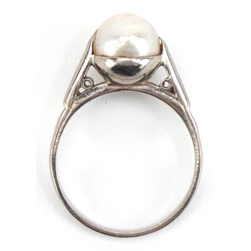 2031 - Unmarked white gold cultured pearl ring, tests as 18ct, the pearl approximately 9mm in diameter, siz... 