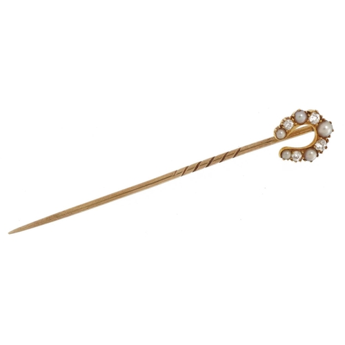 2044 - Victorian unmarked gold diamond and pearl horseshoe stickpin housed in a Mappin & Webb fitted tooled... 