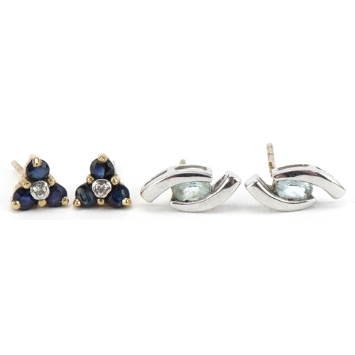 2242 - Two pairs of 9ct gold earrings comprising white gold topaz studs and sapphire and diamond clusters, ... 