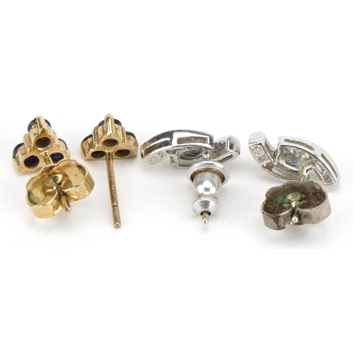 2242 - Two pairs of 9ct gold earrings comprising white gold topaz studs and sapphire and diamond clusters, ... 