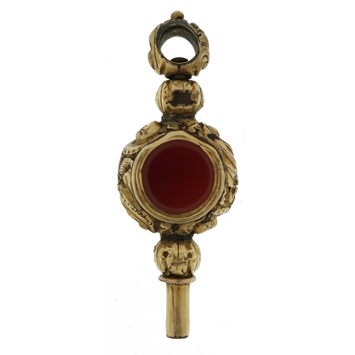 2109 - Antique unmarked gold carnelian watch key tests as 15ct gold, 4.5cm in length, 8.6g