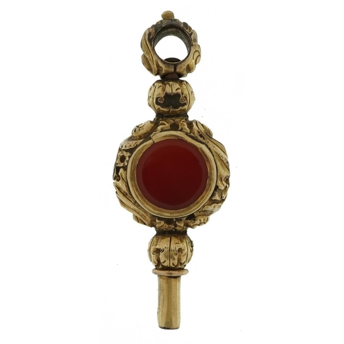 2109 - Antique unmarked gold carnelian watch key tests as 15ct gold, 4.5cm in length, 8.6g