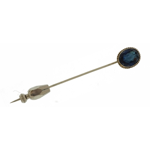 2381 - Unmarked white metal intaglio blue stone stickpin engraved with a bust, housed in a tooled leather b... 