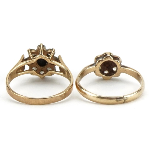 2221 - Two 9ct gold flower head rings, one set with a sapphire, sizes M and L, total 4.0g