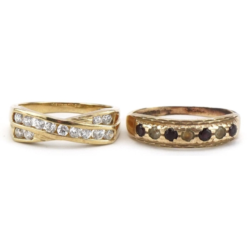 2191 - Two 9ct gold rings including a cubic zirconia crossover example, sizes O and M, total 4.7g