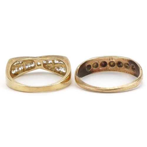 2191 - Two 9ct gold rings including a cubic zirconia crossover example, sizes O and M, total 4.7g