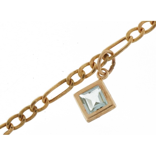 2202 - 9ct gold Figaro link bracelet with topaz charm, 24cm in length, 1.2g