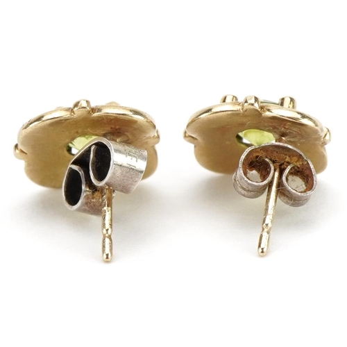 2236 - Pair of 9ct gold topaz stud earrings with silver butterflies, 1.2cm in diameter, weighable gold 2.3g