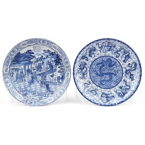 649 - Pair of Chinese blue and white porcelain chargers decorated with figures in a palace setting and dra... 