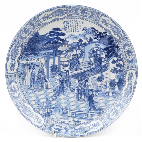 649 - Pair of Chinese blue and white porcelain chargers decorated with figures in a palace setting and dra... 