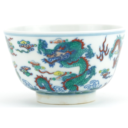 1177 - Chinese doucai porcelain bowl hand painted with dragons amongst clouds, six figure character marks t... 