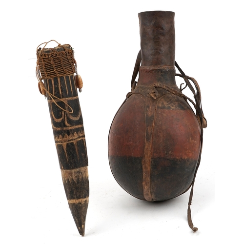1374 - Tribal interest African leather bound wood gourd and one other, the largest 40cm high