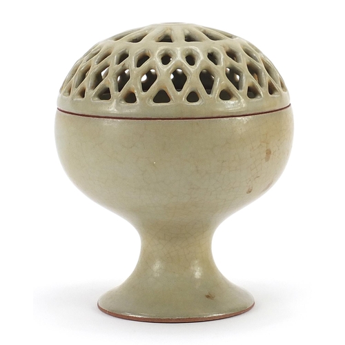 651 - Chinese porcelain pedestal bowl with pierced cover having a celadon glaze, 15.5cm high