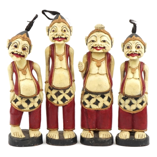 510 - Four Thai hand painted carved wood figures, the largest 52cm high