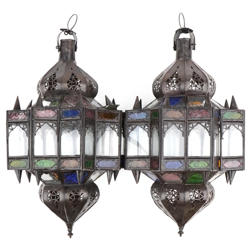 115 - Pair of Moroccan bronzed hanging lanterns with coloured glass panels, 50cm high