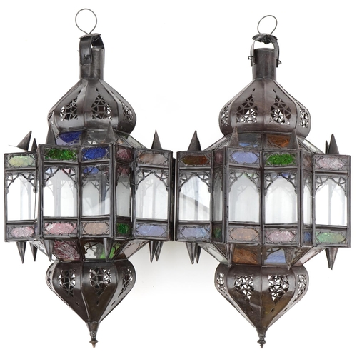 115 - Pair of Moroccan bronzed hanging lanterns with coloured glass panels, 50cm high