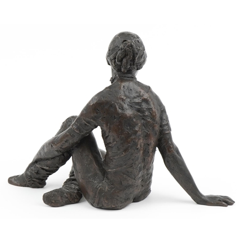 24 - Enid L Bloom, cold cast bronze sculpture of a seated female titled Dance Class and related booklet, ... 