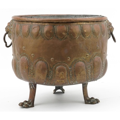 1143 - Large Victorian copper coal bucket with lion mask ring handles and raised on three lion paw feet, 38... 