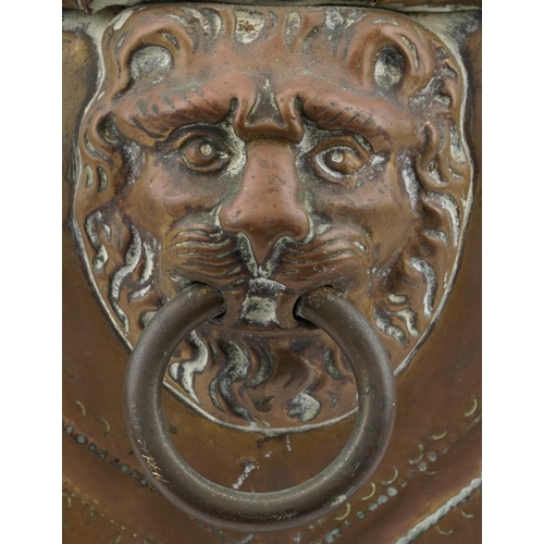 1143 - Large Victorian copper coal bucket with lion mask ring handles and raised on three lion paw feet, 38... 